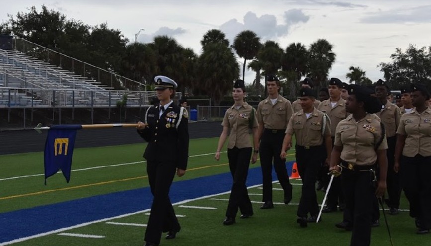 Boca NJROTC cadet officer leading the unit in review